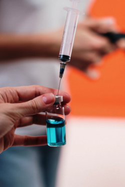 Person Holding A Vaccine Free Stock Photo