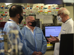 Maryland Gov. Larry Hogan (2d from left) chats with Gale Smith, PhD, Novavax Discovery and Preclinical Research and Chief Scientist, during a tour of the company’s Gaithersburg, MD, facilities. (Office of Governor Larry Hogan)