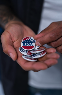 Hands With Vote Pins Free Stock Photo