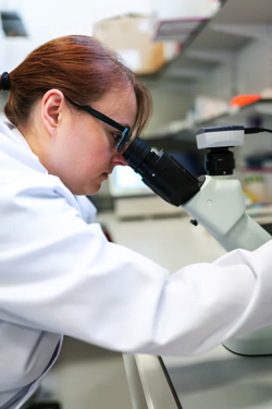 Scientist with microscope